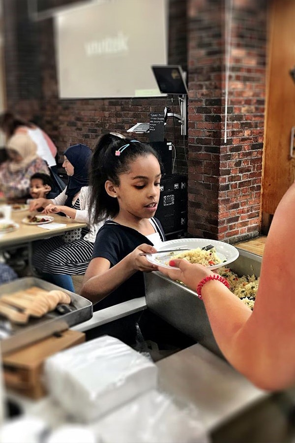 Child getting food in cafeteria